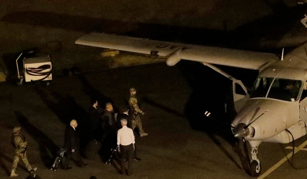 Former Brazilian President Luiz Inacio Lula da Silva us taken to a police plane in Sao Paulo, Brazil. Photo: Reuters