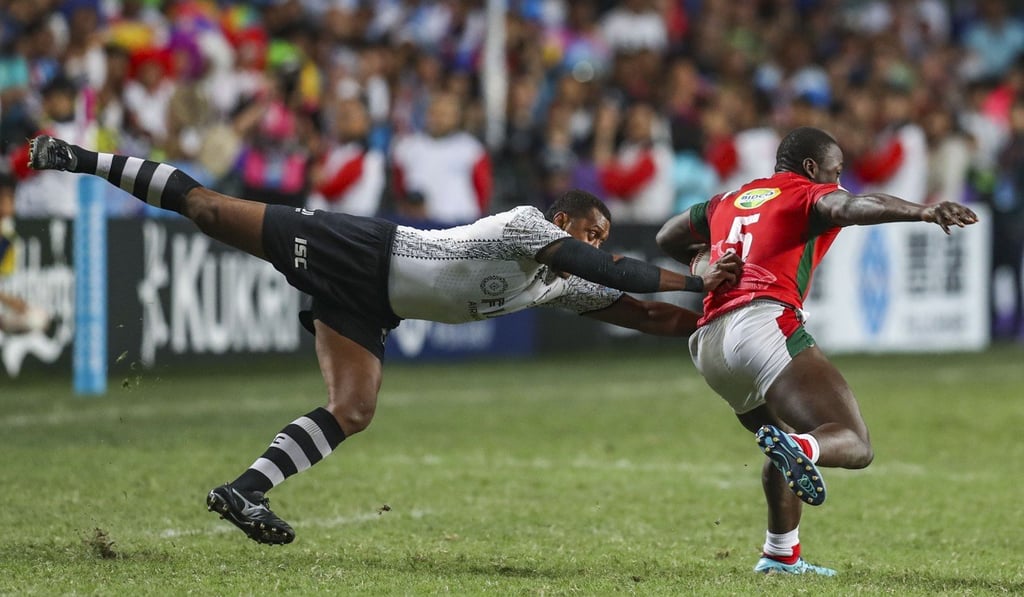 Kenya’s Billy Odhiambo (right) is on the end of a flying tackle during the Cup final. Photo: Winson Wong