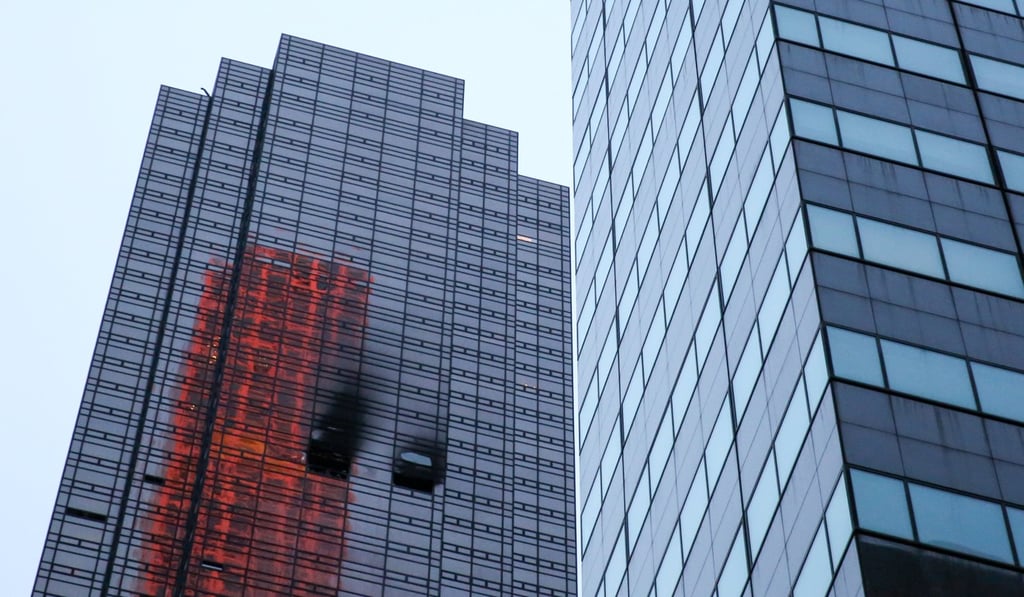 Damaged windows are seen after a fire broke out in an apartment in Trump Tower. Photo: Reuters