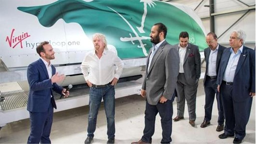Saudi Crown Prince Mohammad bin Salman (centre) at Virgin Galactic with Richard Branson (second left) and an executive. Photo: CNBC Saudi Crown Prince Mohammad bin Salman (centre) at Virgin Galactic with Richard Branson (second left) and an executive. Photo: CNBC
