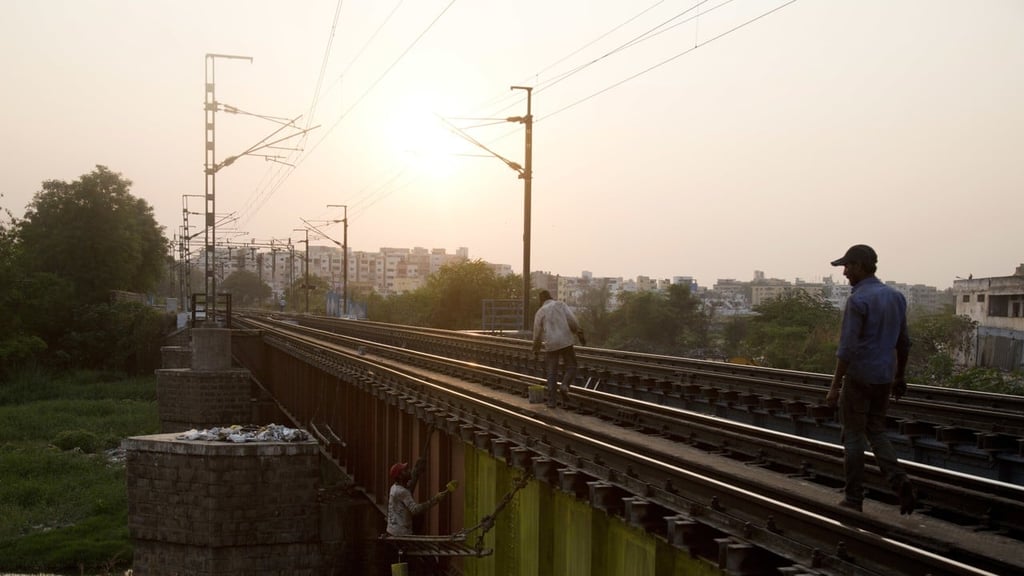 Indian workers paint a railway bridge in Hyderabad, India, in March. Trains in India are notoriously dangerous. In 2015, 30,000 Indians died in rail accidents, according to the latest available data. Photo: AP Indian workers paint a railway bridge in Hyderabad, India, in March. Trains in India are notoriously dangerous. In 2015, 30,000 Indians died in rail accidents, according to the latest available data. Photo: AP