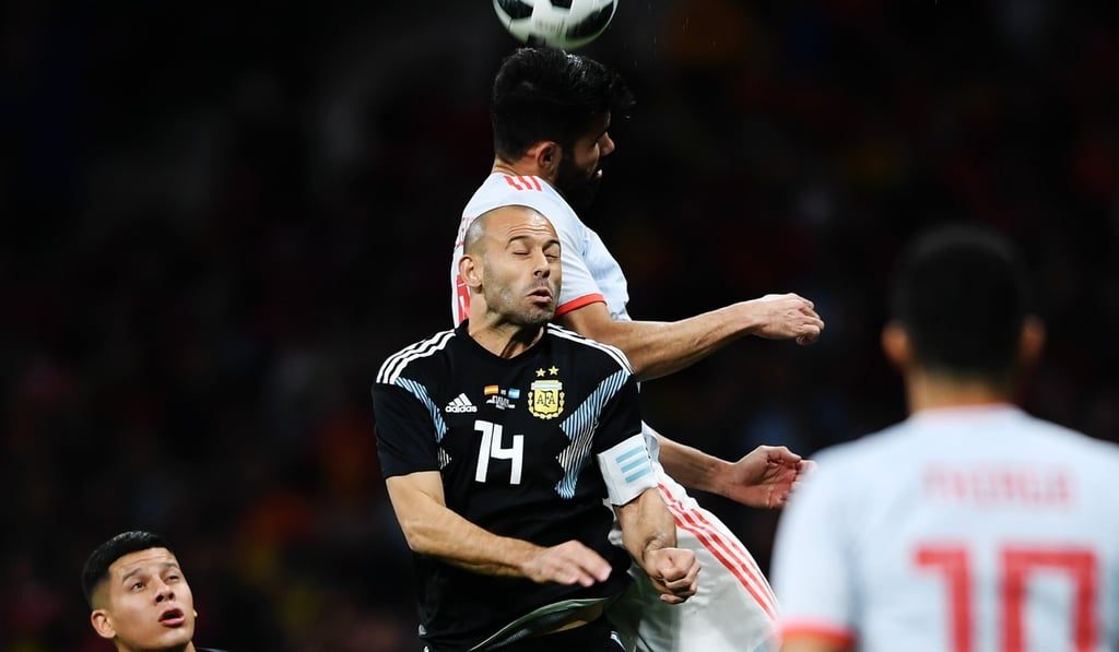 Argentina's Javier Mascherano wearing a wrist band supporting the bid in the recent friendly against Spain. Photo: Xinhua