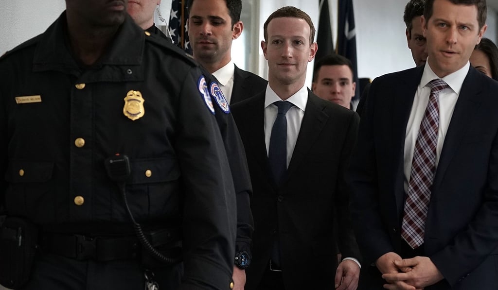 Facebook’s Mark Zuckerberg, centre, arrives for a meeting with US lawmakers on Monday in Washington. Photo: Getty Images/AFP Facebook’s Mark Zuckerberg, centre, arrives for a meeting with US lawmakers on Monday in Washington. Photo: Getty Images/AFP