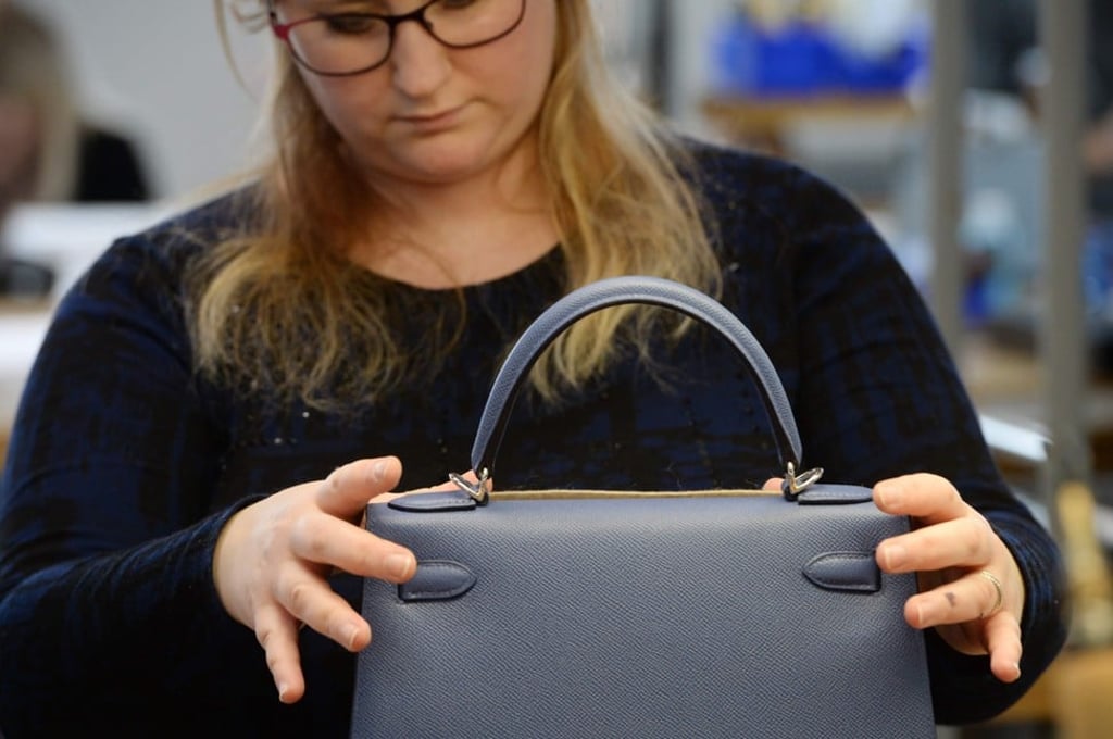 A craftsman on a training course works on a purse in the new leather goods workshop of French high-fashion luxury goods manufacturer Hermès in Allenjoie, eastern France. Photo: Sebastien Bozon/ AFP A craftsman on a training course works on a purse in the new leather goods workshop of French high-fashion luxury goods manufacturer Hermès in Allenjoie, eastern France. Photo: Sebastien Bozon/ AFP