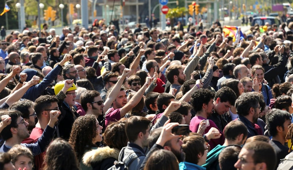 Demonstrators take part in a protest outside a building where Spain's King Felipe was attending a ceremony on Monday in Barcelona, Spain. Photo: Reuters