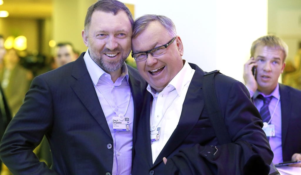 Oleg Deripaska, billionaire and chief executive officer of United Co Rusal (left, with and Andrey Kostin, chief executive officer of VTB Group) is seen in Davos in January 2015. United Co Rusal – the biggest aluminium maker outside China – and seven other Deripaska-linked firms were the most prominent targets in a list of 12 Russian companies the US hit with sanctions to subvert Western democracies. Photo: Bloomberg Oleg Deripaska, billionaire and chief executive officer of United Co Rusal (left, with and Andrey Kostin, chief executive officer of VTB Group) is seen in Davos in January 2015. United Co Rusal – the biggest aluminium maker outside China – and seven other Deripaska-linked firms were the most prominent targets in a list of 12 Russian companies the US hit with sanctions to subvert Western democracies. Photo: Bloomberg