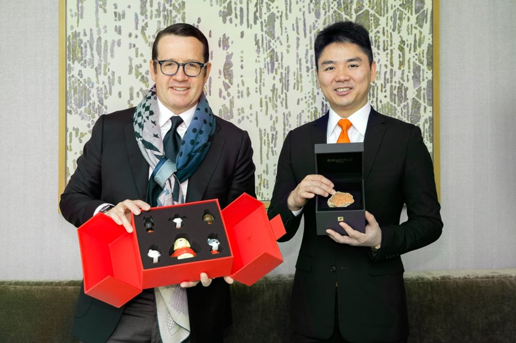 Audemars Piguet CEO François-Henry Bennahmias (left) and Richard Liu, founder of JD.com, with souvenirs marking the launch of their collaboration in Beijing on Tuesday.