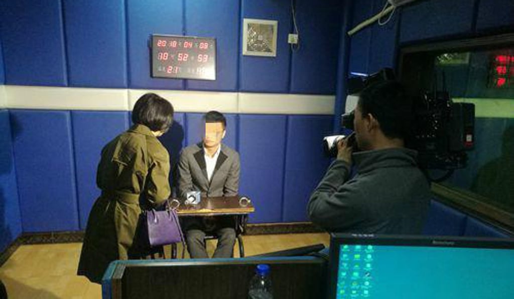 The suspect is questioned at a police station after being picked out of a concert crowd. Photo: 163.com The suspect is questioned at a police station after being picked out of a concert crowd. Photo: 163.com