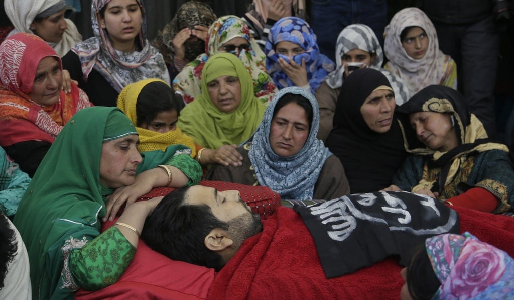 Relatives grieve over the body of Sarjeel Sheikh, a civilian who was shot earlier this month during a protest near a gun battle in Khudwani village about 60km south of Indian controlled Kashmir. Photo: AP