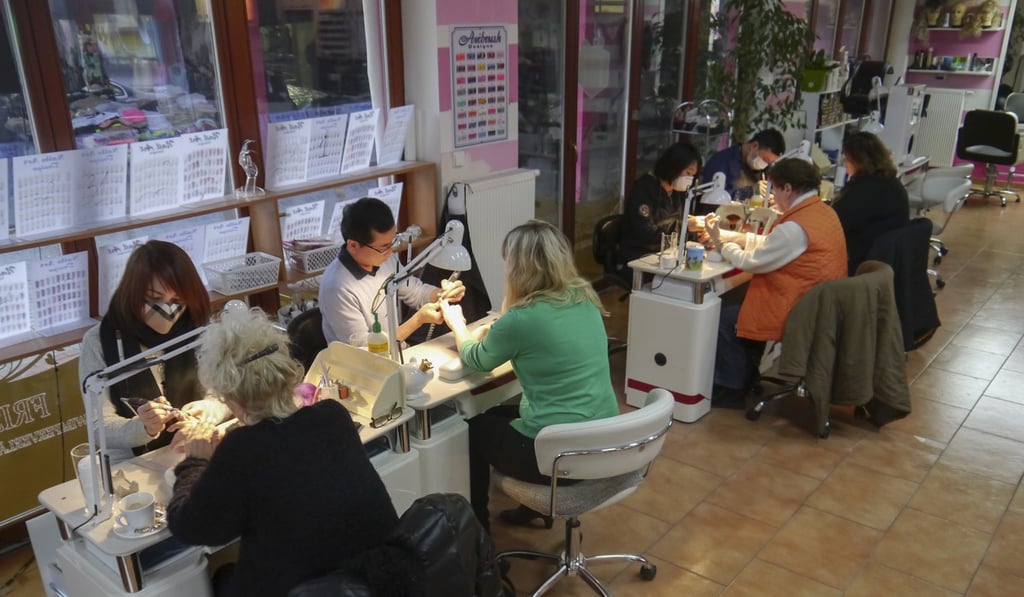 Women receiving manicures at Asia Dragon Bazar. Picture: Jens Kastner