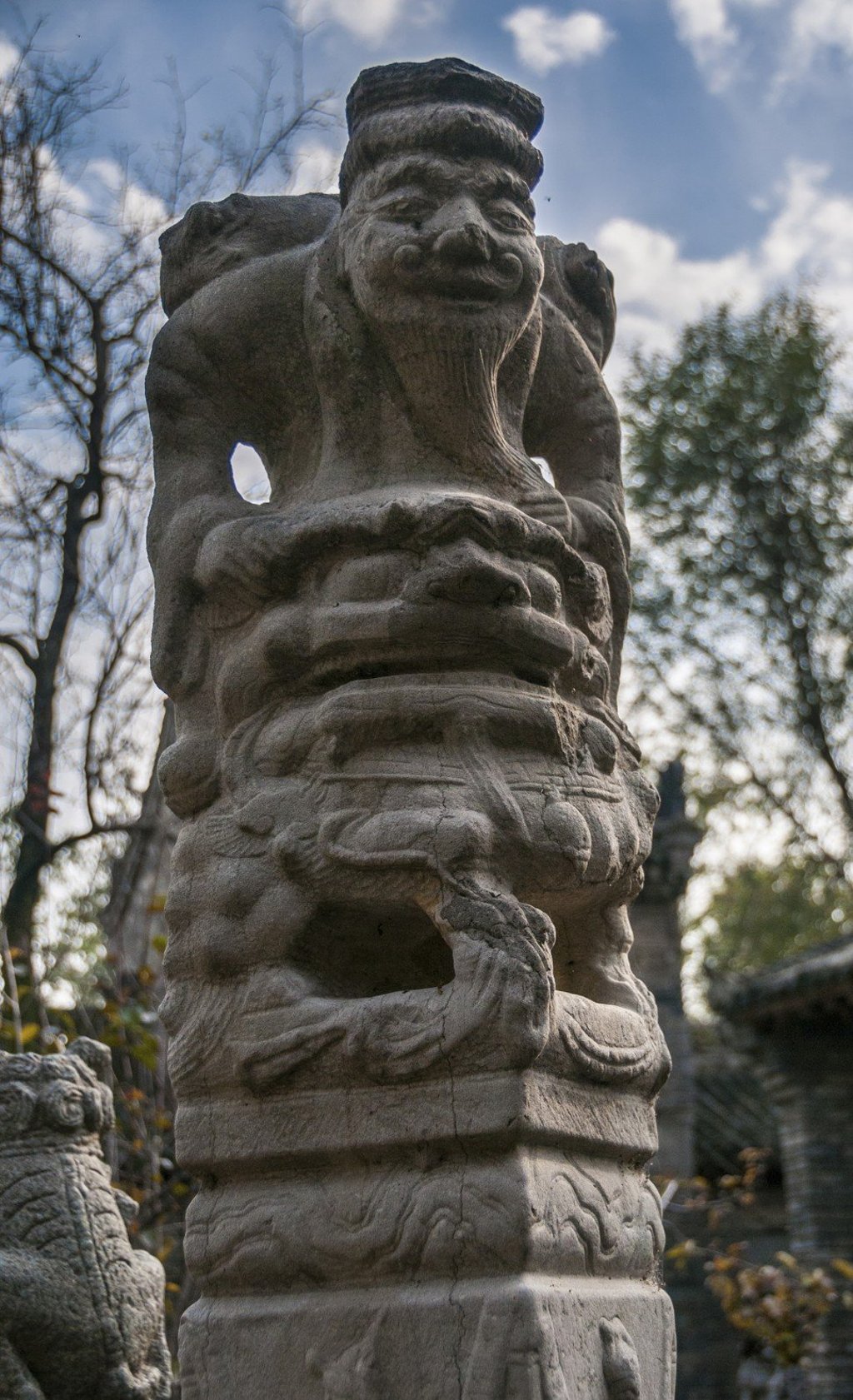 A post statue of a bearded old man riding a lion-like creature, part of Wu’s collection. Photo: Mark Andrews