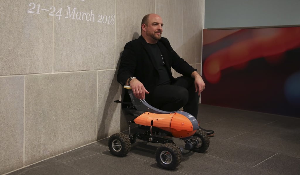 Ben Scott-Robinson, founder of The Small Robot Company, showing one of his farming robots at the Great Festival of Innovation.