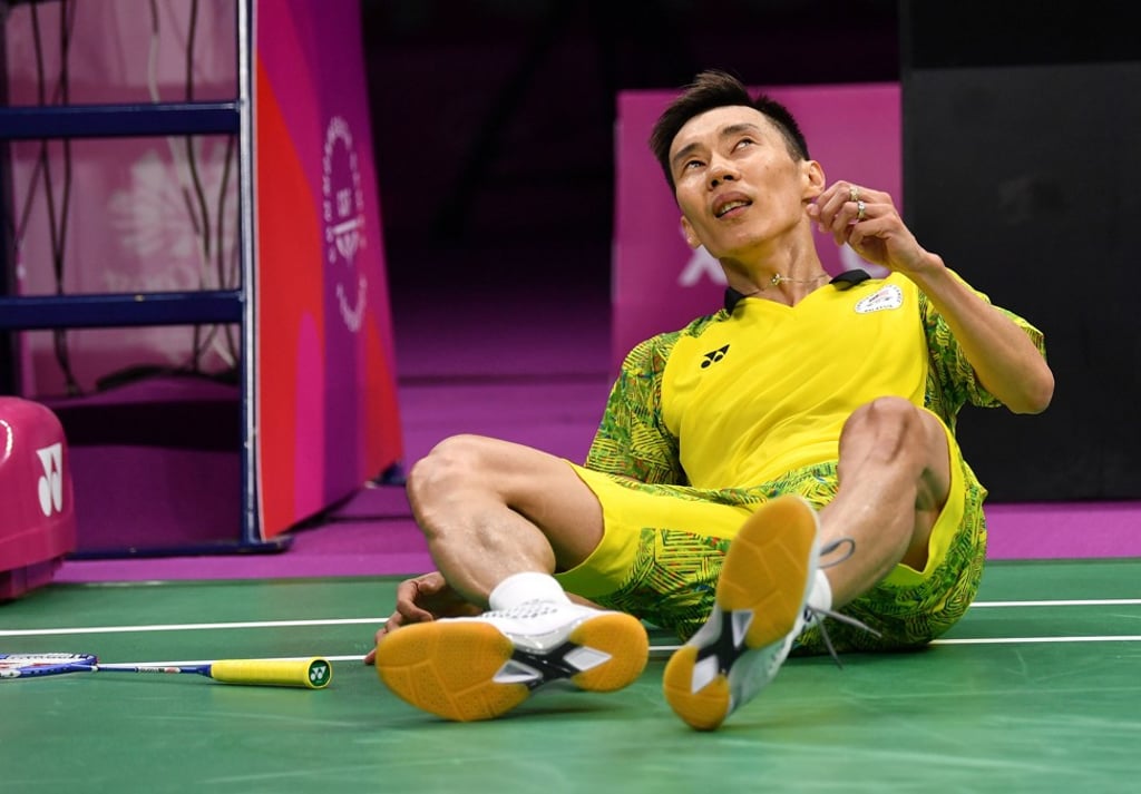 Malaysia’s Lee Chong Wei collapses to the floor in celebration after his victory over Srikanth Kidambi. Photo: AFP