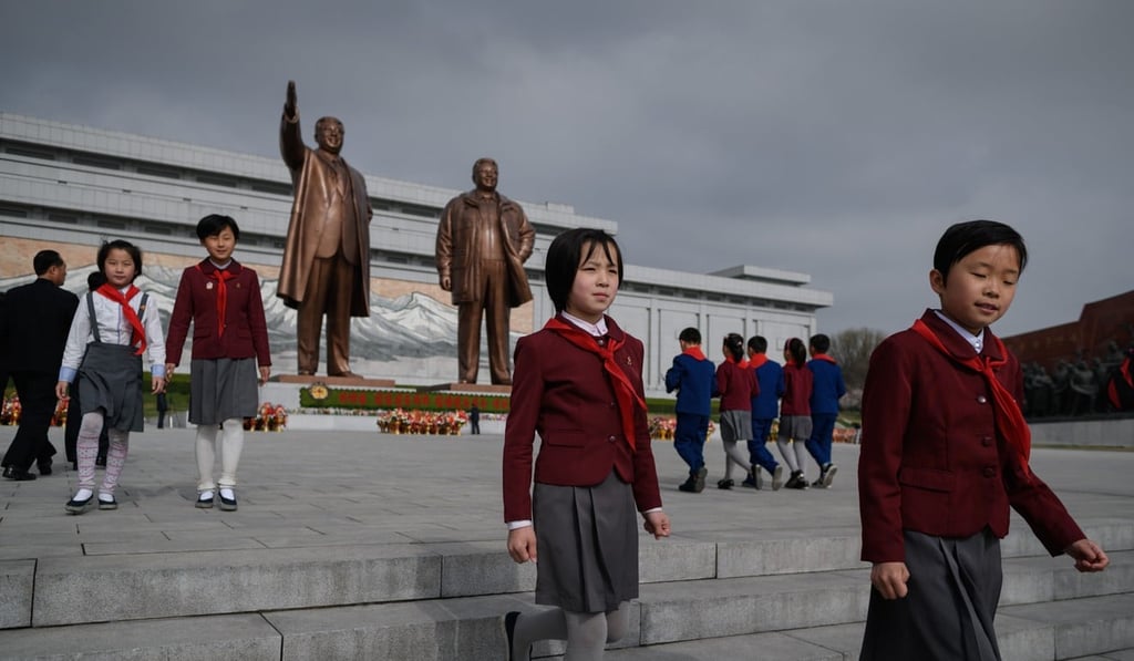 Schoolchildren after paying their respects. Photo: AFP