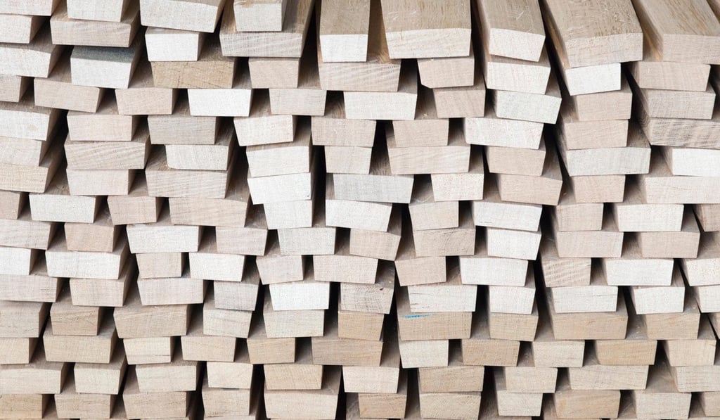 A pile of oak staves used for making wine barrels.