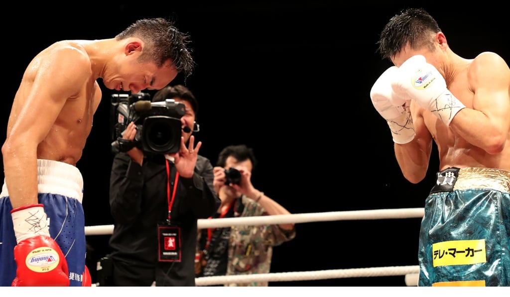 Rex Tso bows to Kohei Kono after the dramatic conclusion to their super flyweight fight. Photo: Edward Wong