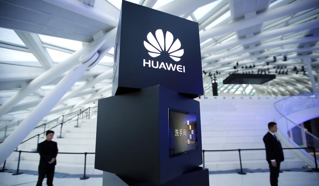 In this May 26, 2016 photo, security personnel stand near a pillar with the Huawei logo at a launch event for the Huawei MateBook in Beijing. Photo: AP In this May 26, 2016 photo, security personnel stand near a pillar with the Huawei logo at a launch event for the Huawei MateBook in Beijing. Photo: AP