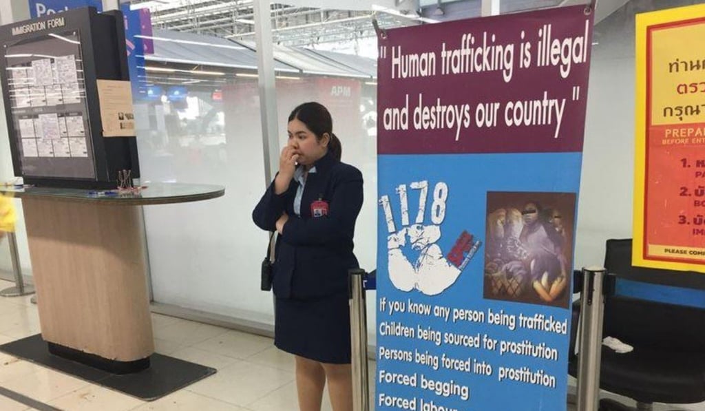 A banner with a message warning against human trafficking at Bangkok's main Suvarnabhumi Airport. Photo: Thomson Reuters Foundation