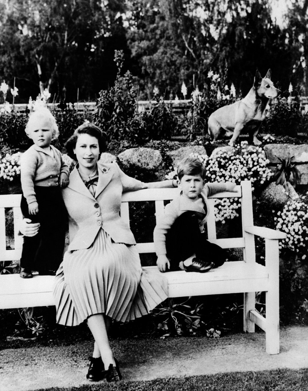 An undated picture of Queen Elizabeth with her children Charles and Ann and a corgi at the royal estate in Balmoral, Scotland. Photo: AFP