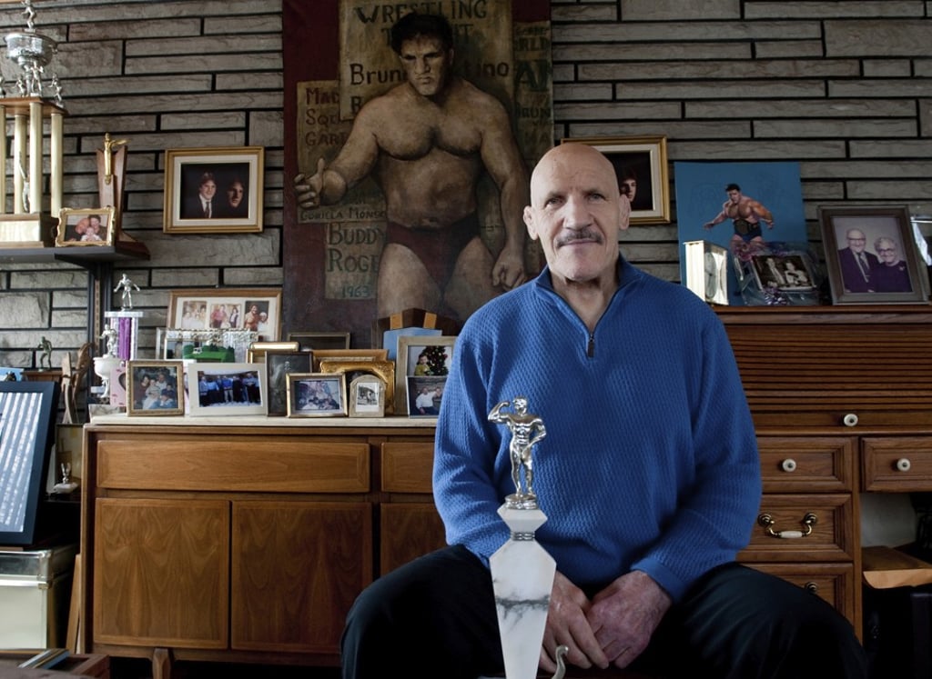 In this March 27, 2013, file photo, Bruno Sammartino sits in front of pictures, paintings and trophies highlighting his storied career as a wrestler and weightlifter, at his home in his North Hills, Pennsylvania home. Photo: AP