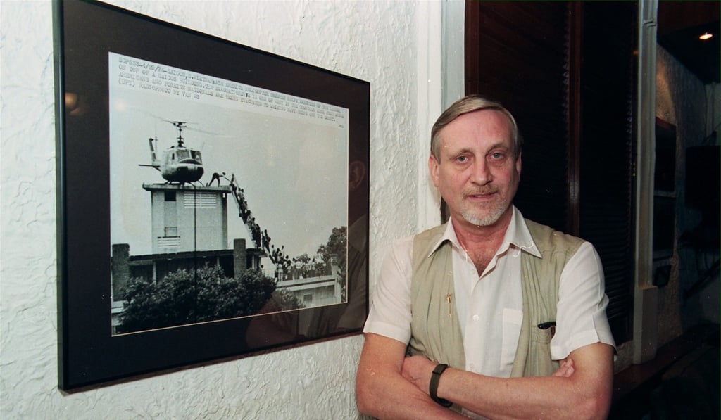 Photographer Hugh van Es with his famous photo from the Vietnam war.