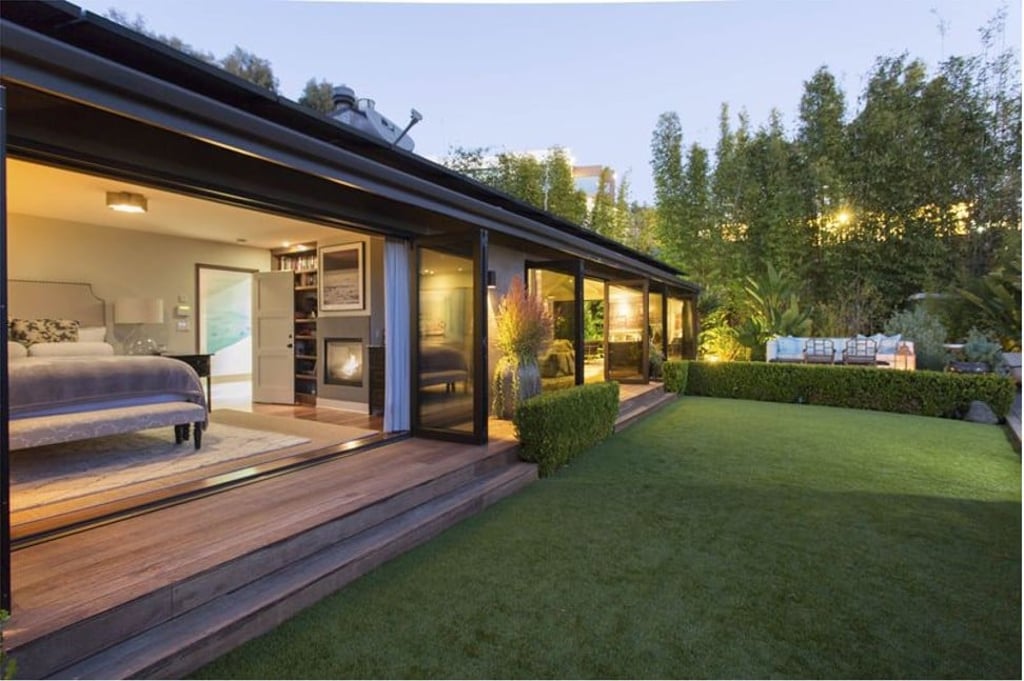 Most of the bungalow’s rooms open to the outside, with accordion glass doors. Photo: Sotheby's International Realty Most of the bungalow’s rooms open to the outside, with accordion glass doors. Photo: Sotheby's International Realty