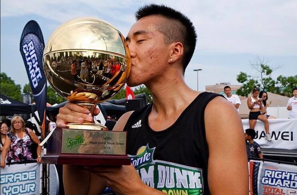 A 17-year-old Su kisses his trophy after winning the NBA Sprite Slam Showdown in 2012. Photo: Handout A 17-year-old Su kisses his trophy after winning the NBA Sprite Slam Showdown in 2012. Photo: Handout
