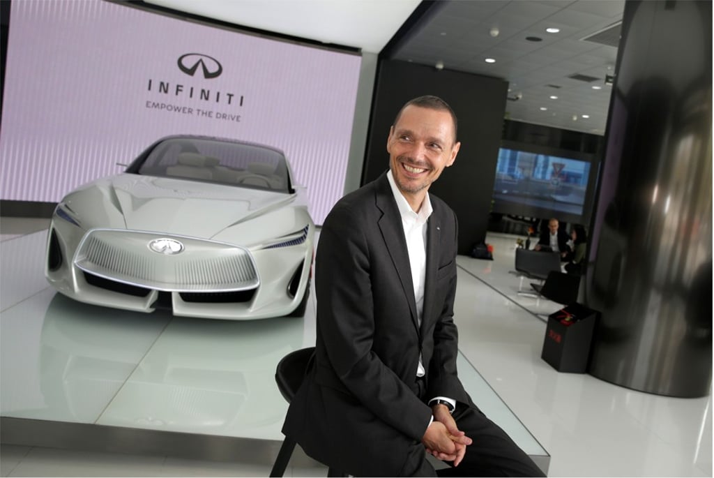 Roland Kruger, president of Infiniti Motor Company, sits next to an Infiniti Q Inspiration concept car in Beijing. Photo: Reuters