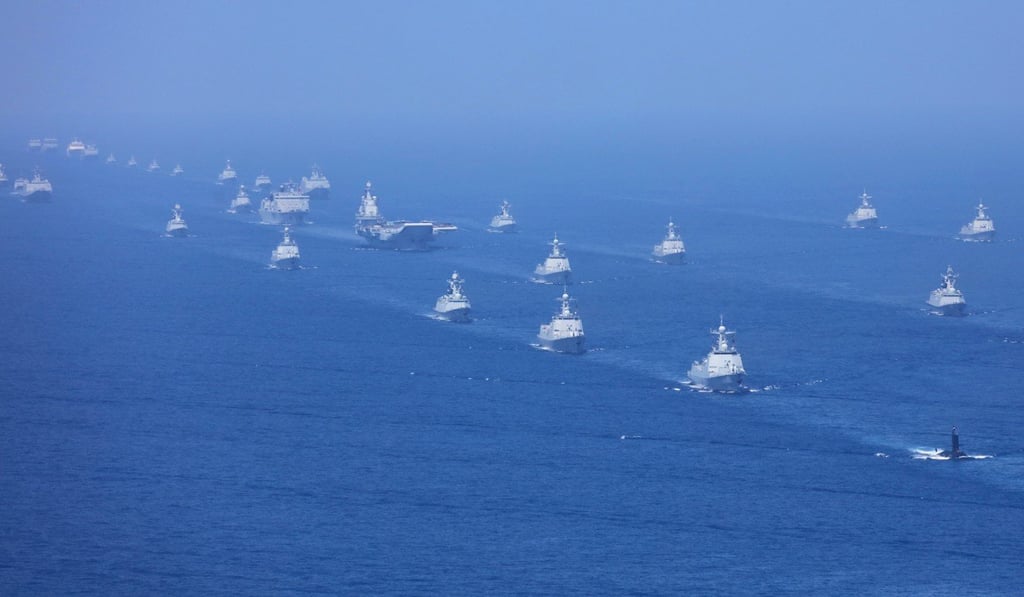 PLA submarines, naval vessels and fighter jets accompany China’s aircraft carrier Liaoning on exercises in the South China Sea. Photo: Xinhua