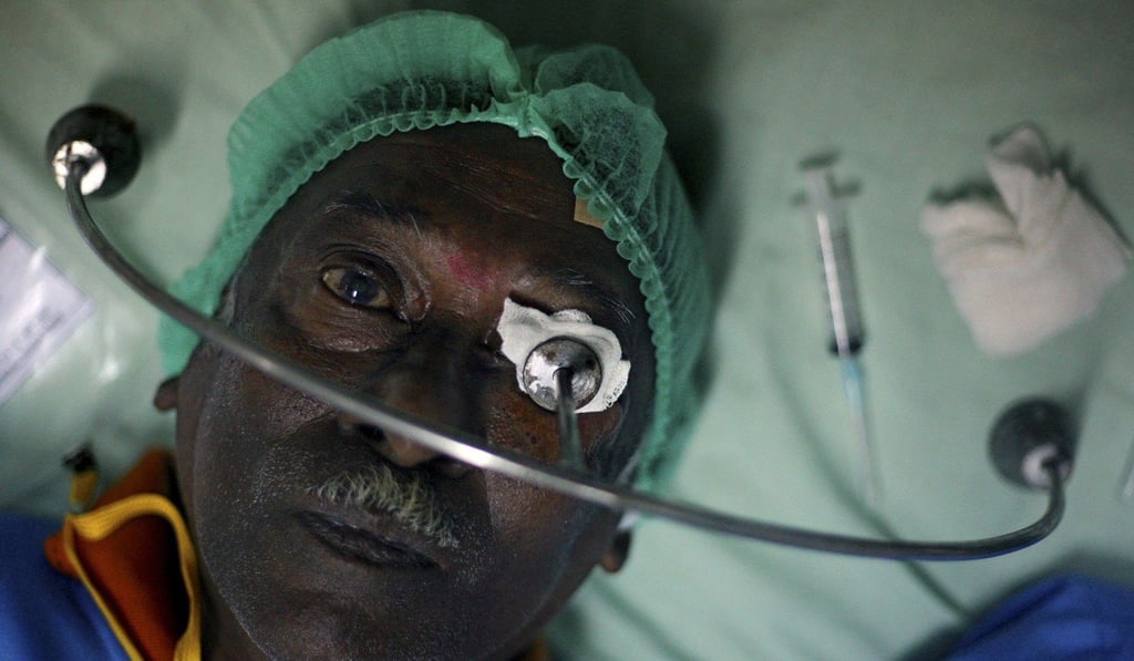 A patient awaits a free cataract surgery at Putri Hijau military hospital in Medan, North Sumatra, Indonesia. Photo: AP