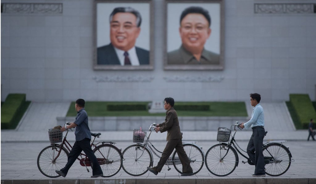 Portraits of late leaders Kim Il-sung (left) and his son Kim Jong-il in a Pyongyang square. Photo: AFP
