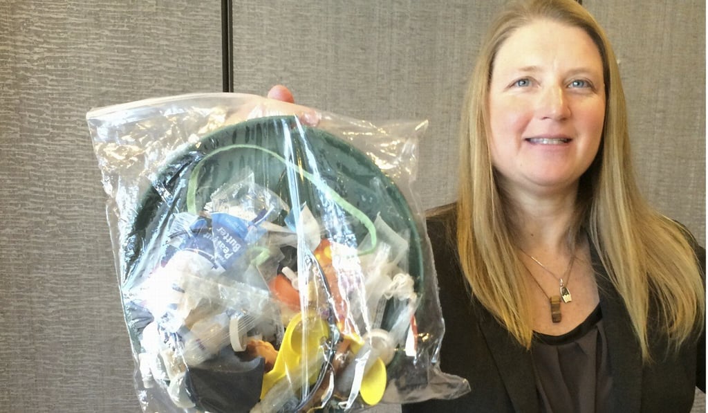 File photo of Jenna Jambeck holding a plastic bag with rubbish collected from Panama Beach, Florida. Photo: AP File photo of Jenna Jambeck holding a plastic bag with rubbish collected from Panama Beach, Florida. Photo: AP