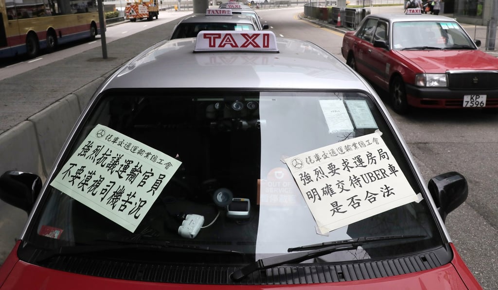 About 30 taxi drivers and owners staged a protest on Sunday. Photo: SCMP Pictures