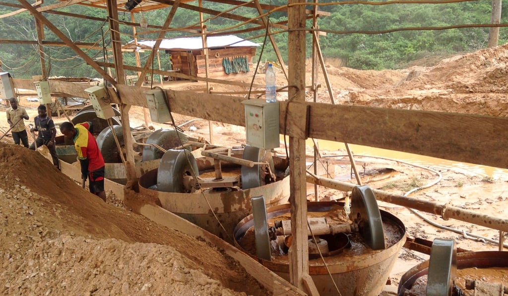 In this photograph taken on April 4, employees of a Chinese mining company operates machinery at a mining site in the Cameroon town of Longa Mali. Photo: Agence France-Presse