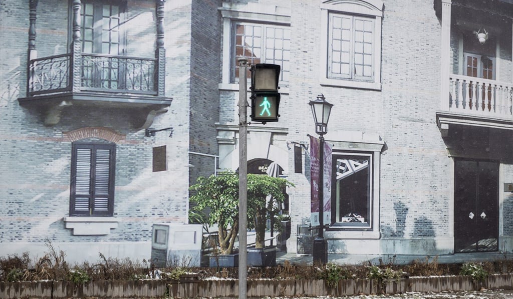 Canvases printed with photographs of old Shanghai line the test zone.