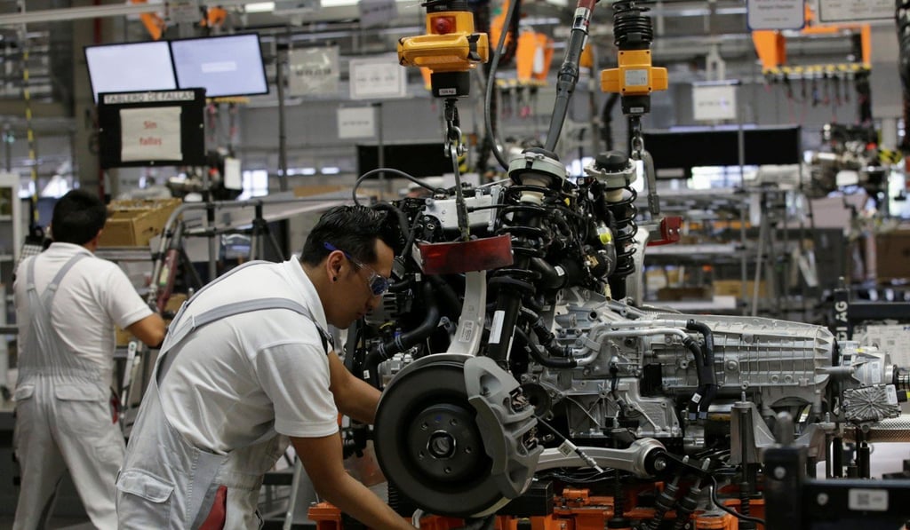 Employees work on an Audi production line in the German car manufacturer's plant in San Jose Chilapa, Mexico, in April. Photo: Reuters