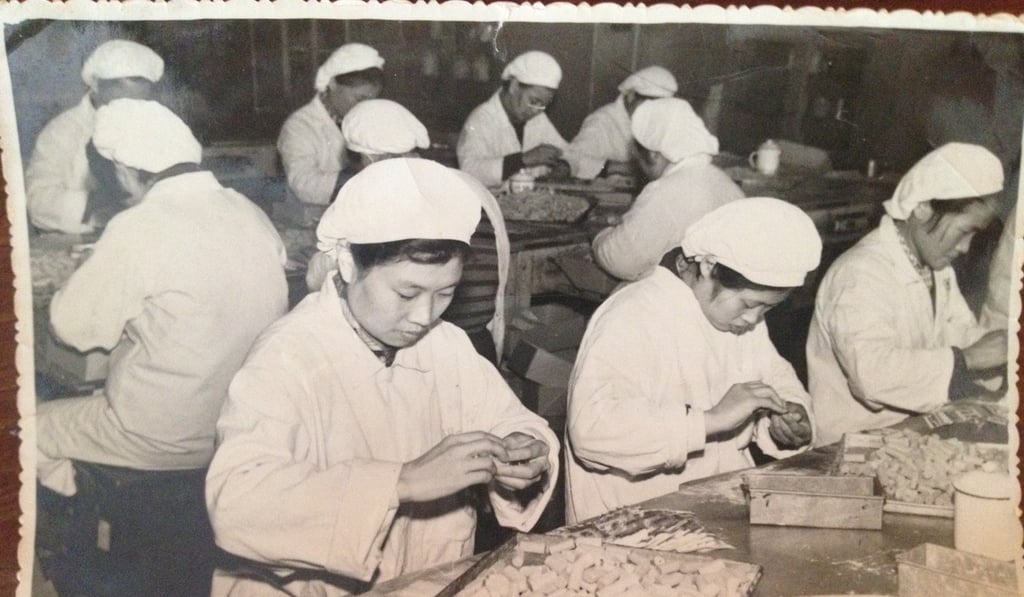 Workers produce the sweets in the original factory at Caobao Road in Shanghai’s city centre. Photo: Guan Sheng Yuan Food Group