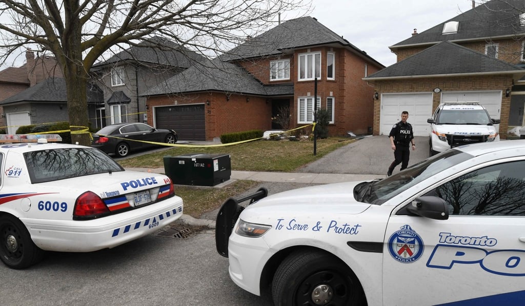 Police vehicles are parked in front of the home of Alek Minassian in Toronto on Tuesday. Photo: Reuters
