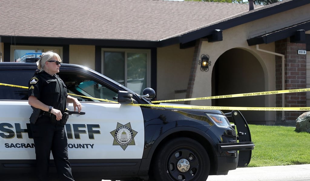 A Sacramento County sheriff’s deputy stands guard in front of the home of accused rapist and killer Joseph James DeAngelo on Wednesday in Citrus Heights, California. DeAngelo, 72, is believed to be the Golden State Killer, who killed at least 12, raped over 45 people and burglarised hundreds of homes throughout California in the 1970s and 1980s. Photo: Getty Images via Agence France-Presse