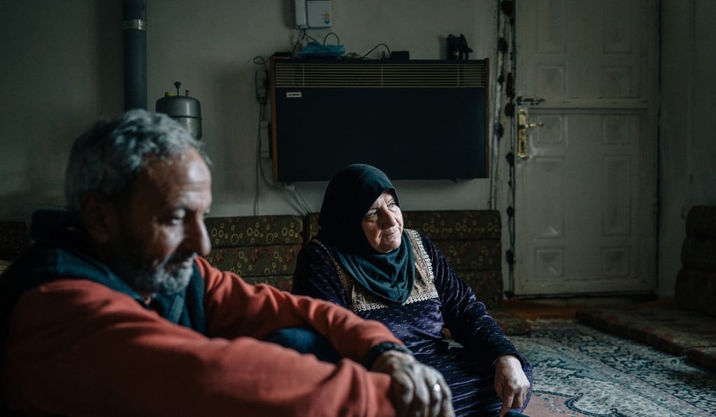 Samira al-Nasr sits in her living room in Raqqa with her husband Hassan al-Hammam. Photo: Washington Post Samira al-Nasr sits in her living room in Raqqa with her husband Hassan al-Hammam. Photo: Washington Post