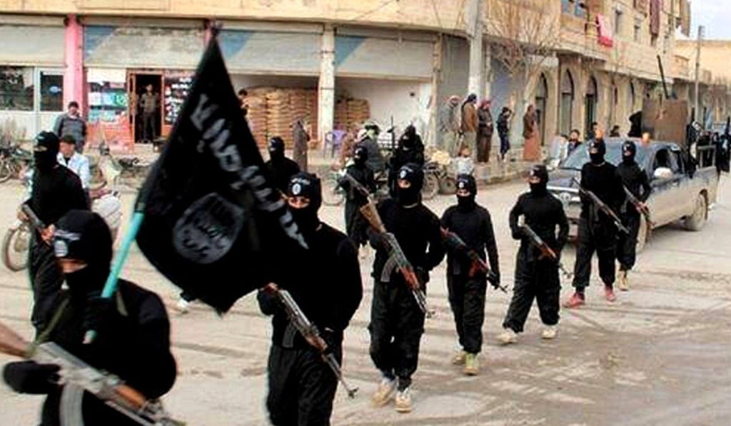 This undated file image posted on a militant website in 2014 shows Islamic State fighters in Raqqa, Syria. Photo: AP