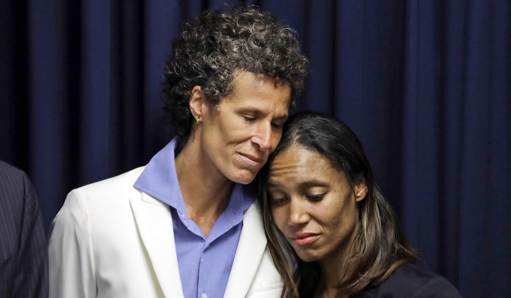 Bill Cosby accuser Andrea Constand, left, embraces prosecutor Kristen Feden during a news conference after Cosby was found guilty in his sexual assault retrial on Thursday in Norristown, Pennsylvania. Photo: AP