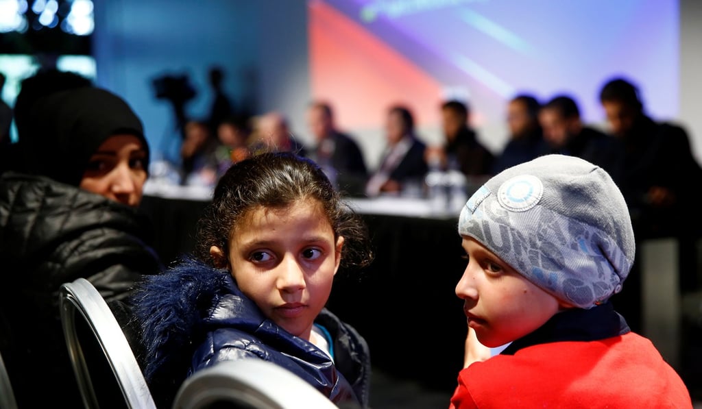 Unidentified children from Douma, Syria, attend a news conference in The Hague, Netherlands, on Thursday. Photo: Reuters