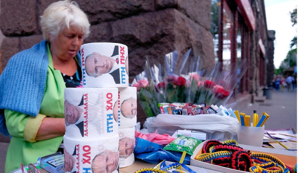 Toilet paper with images of Vladimir Putin for sale on a street stall in Kiev.