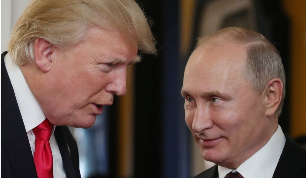 US President Donald Trump chats with Russia’s President Vladimir Putin at the APEC Economic Leaders’ Meeting in Vietnam in November 2017. Photo: AFP