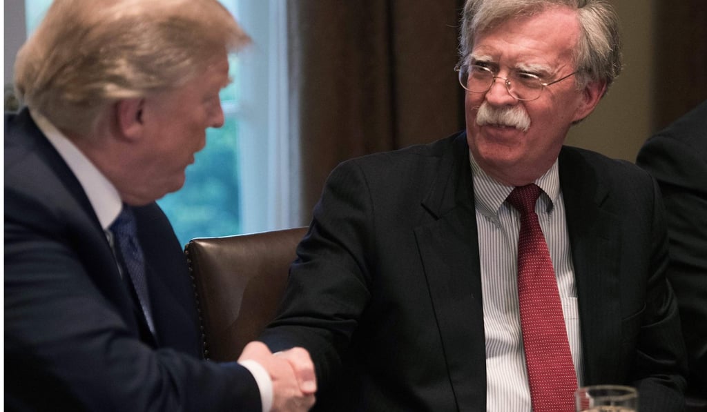 File photo of US President Donald Trump with Bolton during a meeting of senior military leaders at the White House. Photo: AFP
