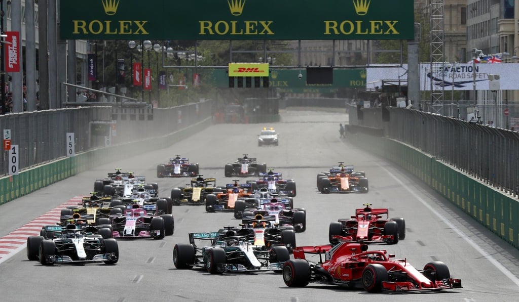 German Formula One driver Sebastian Vettel leads the pack at the start of the race. Photo: EPA