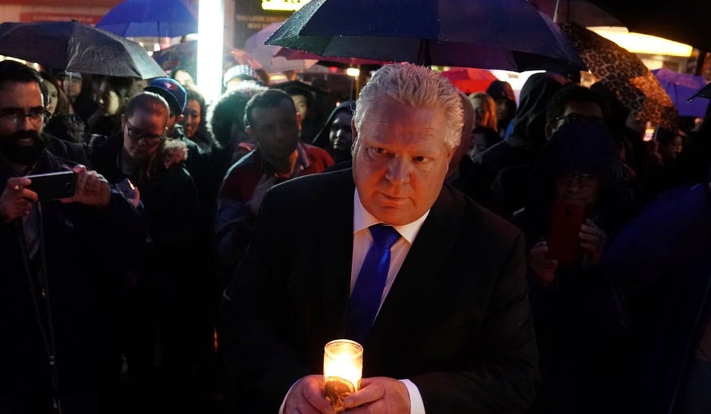 Ontario PC Party leader Doug Ford attends a candlelight vigil at the makeshift memorial a day after a van struck and killed 10 people in Toronto, Ontario, on April 24. Photo: Reuters