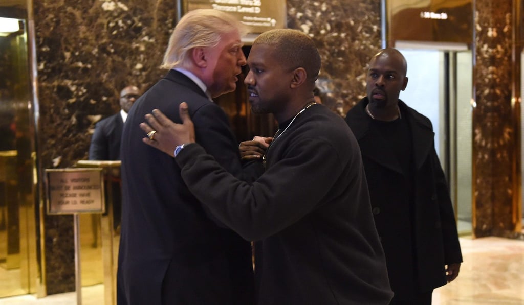 Singer Kanye West and then president-elect Donald Trump talk at Trump Tower, New York, after a meeting in December 2016. Photo: AFP