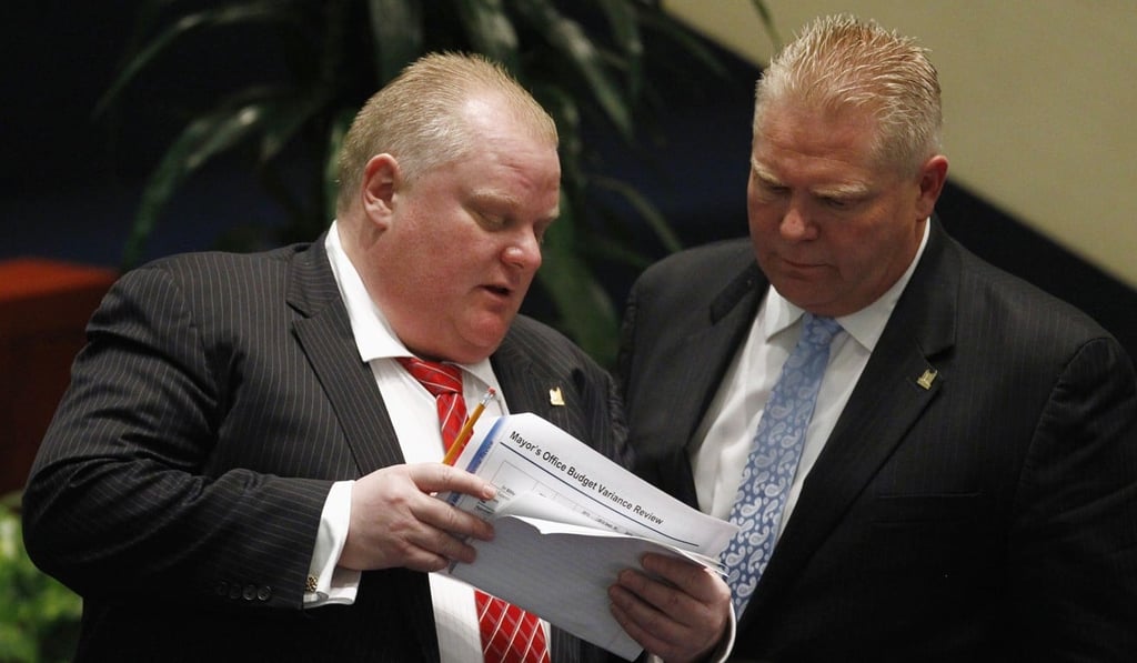 Late Toronto mayor Rob Ford (left) and city councillor Doug Ford at City Hall in 2013. Photo: Reuters